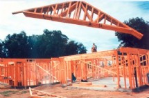 Trusses boomed onto braced walls